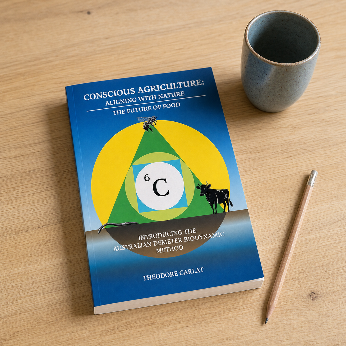 Conscious Agriculture: Aligning with Nature paperback on a naturally lit reading table
