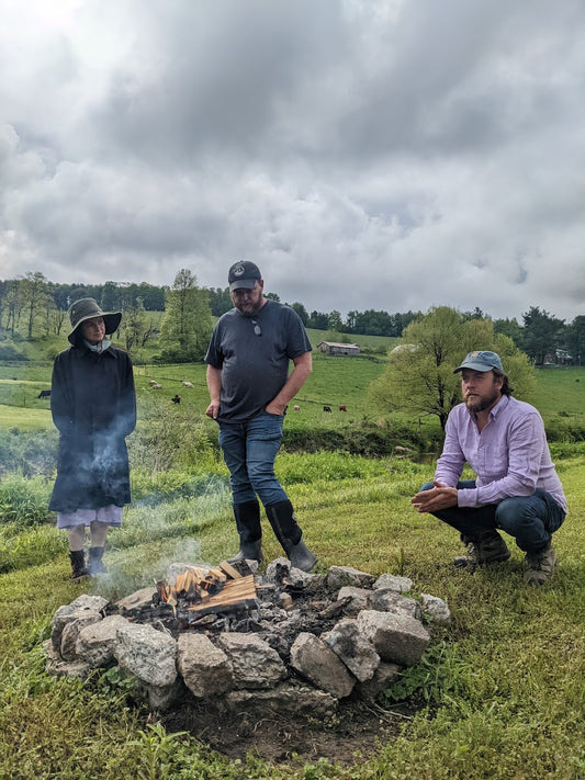 Participants tending a fire during JPI’s 2022 Biodynamic Pest Pepper Workshop