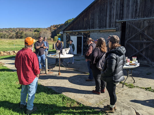 Participants gathered around a demonstration table during JPI’s 2022 Biodynamic Intensive