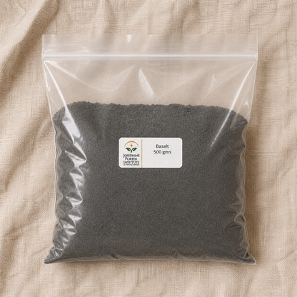 Basalt 500 g packet and very fine charcoal-gray basalt flour, overhead view