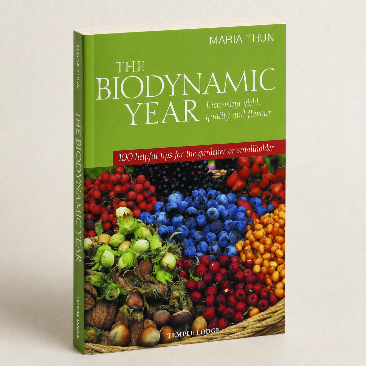 The Biodynamic Year paperback on a softly lit off-white background