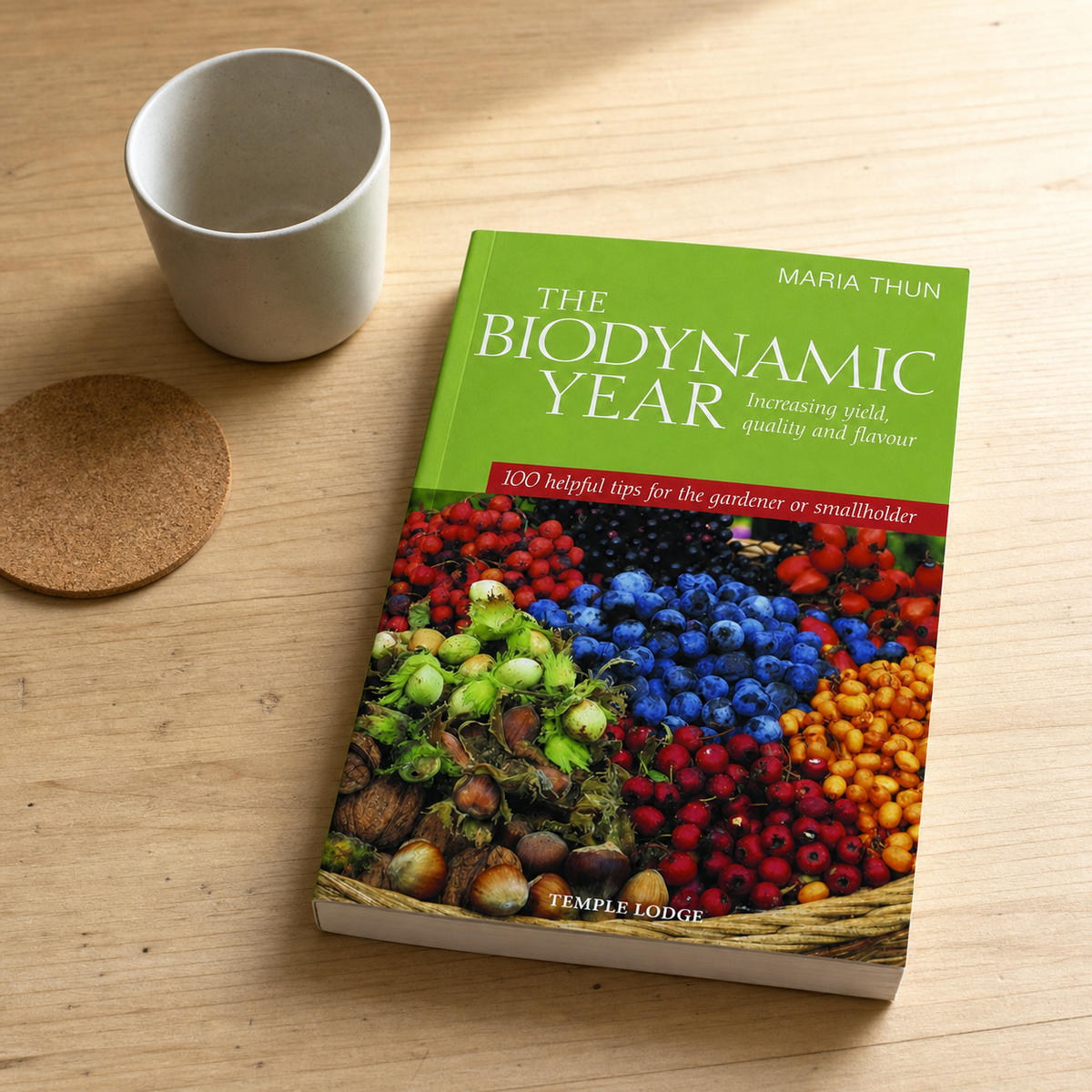 The Biodynamic Year paperback on a naturally lit reading table