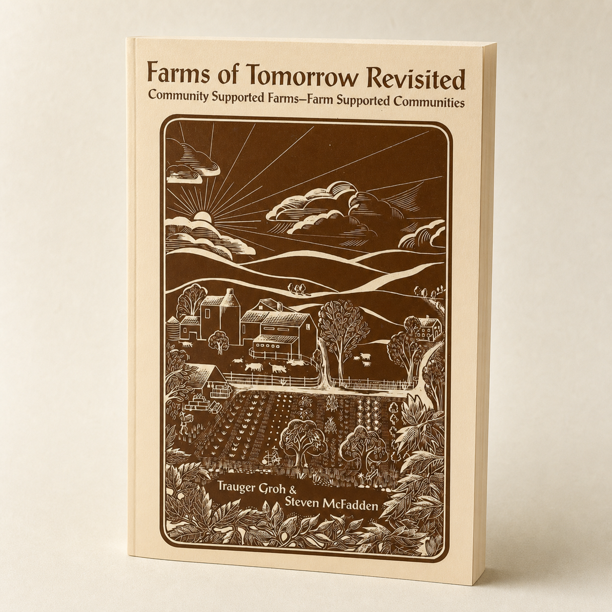 Farms of Tomorrow Revisited paperback on a softly lit off-white background