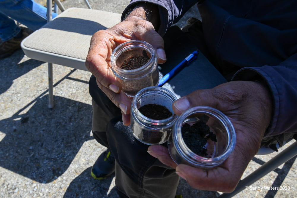 Hands holding jars of biodynamic preparations