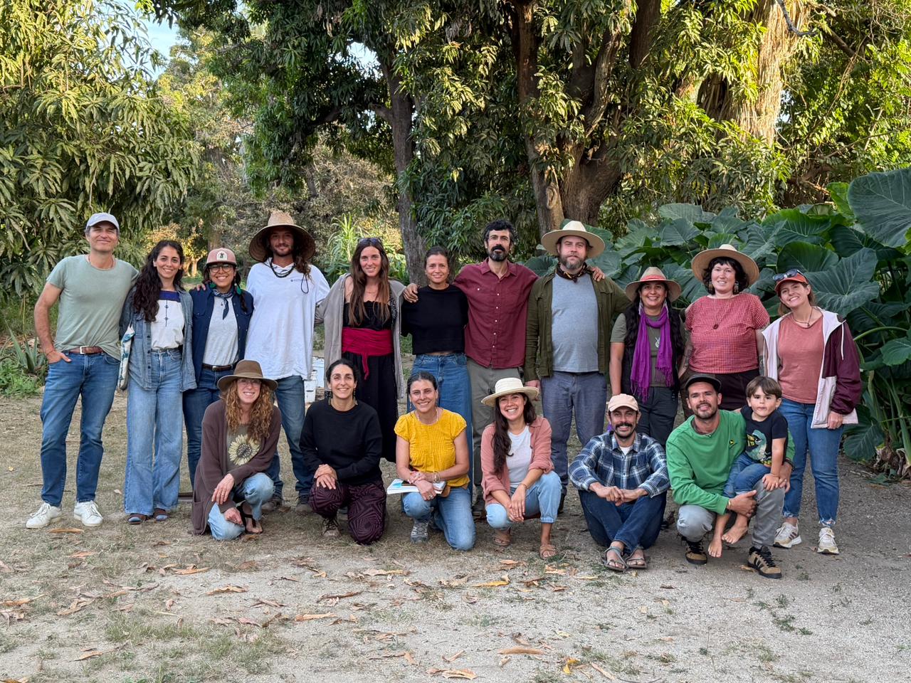 A diverse biodynamic community gathered outdoors