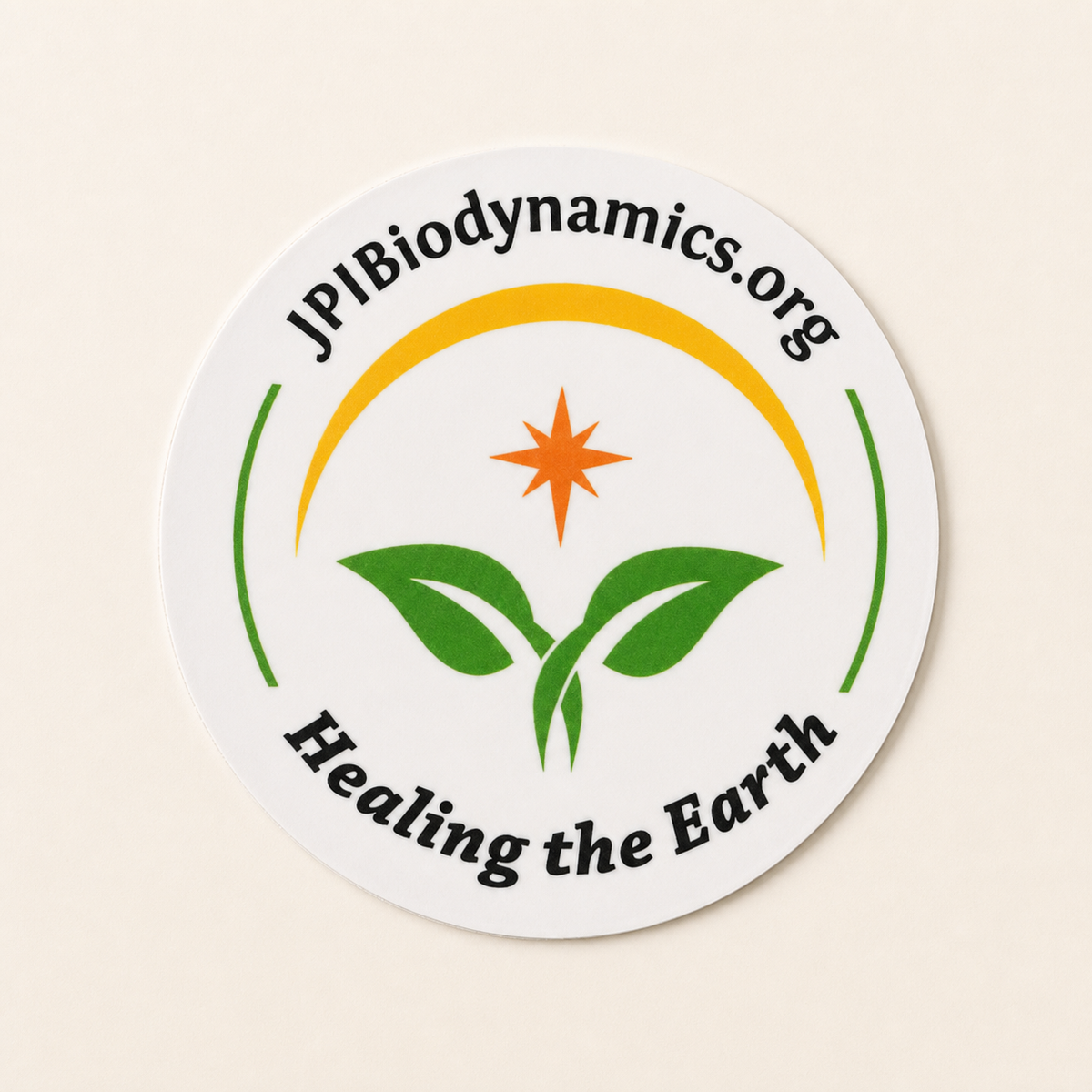Single round JPI Biodynamics Healing the Earth logo sticker on a clean background
