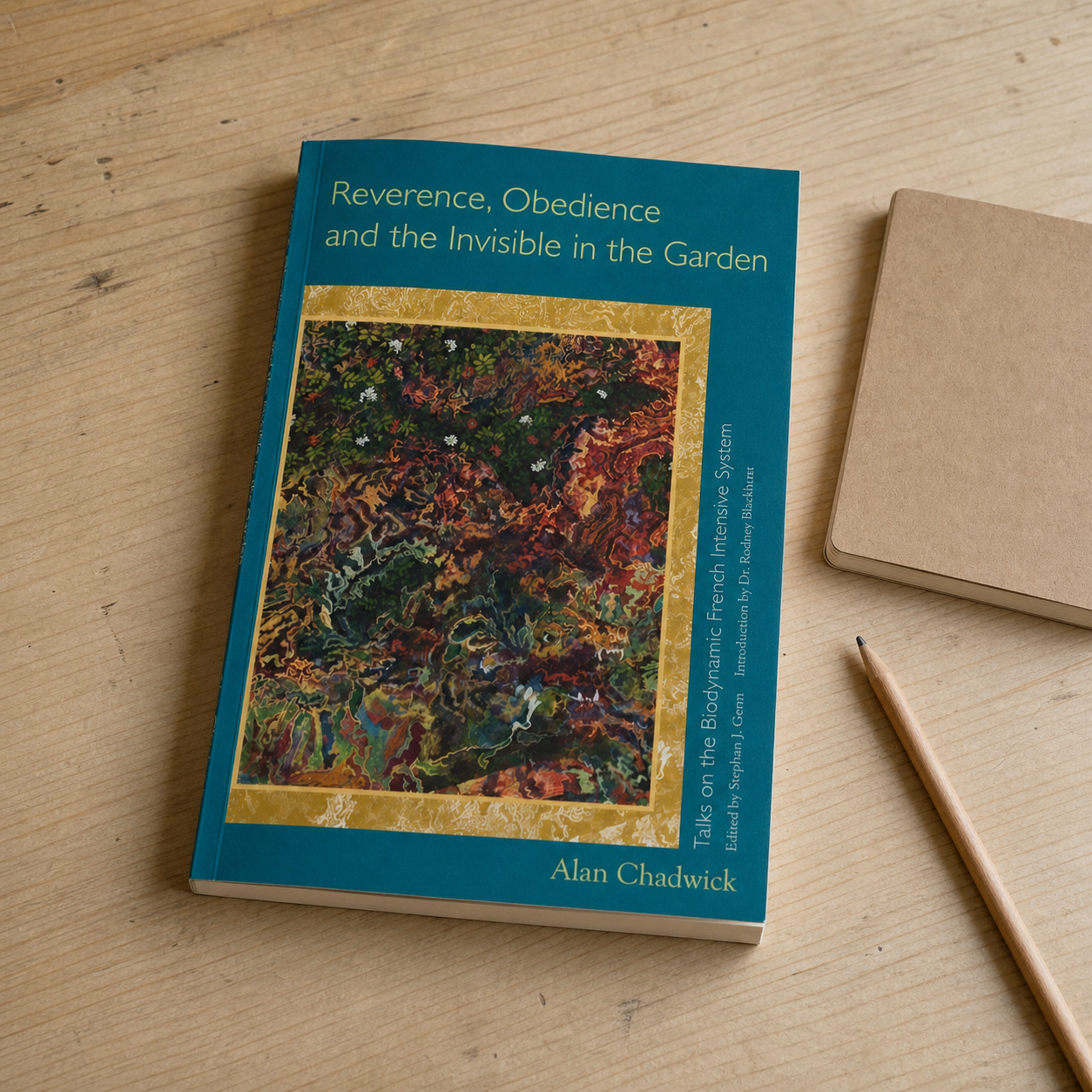 Reverence, Obedience, and the Invisible in the Garden paperback on a naturally lit reading table